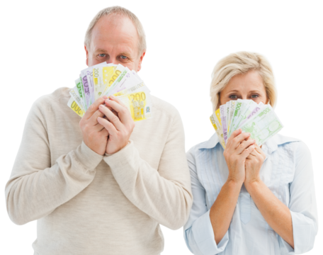 Happy mature couple smiling at camera showing money