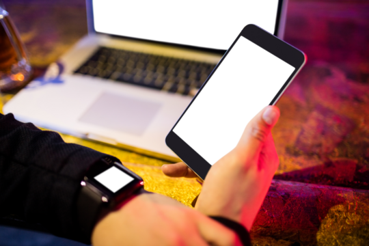 businessman with various technologies - Powered by Adobe