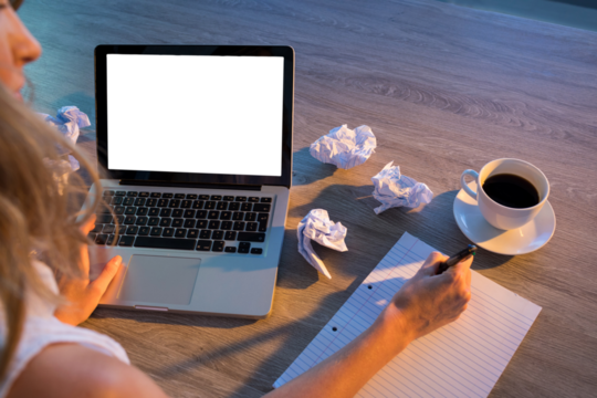 Cropped hands of female executive writing in diary - Powered by Adobe
