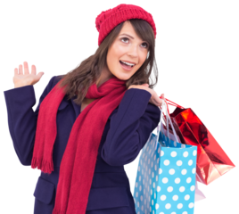Happy brunette in winter clothes holding shopping bags