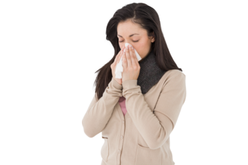 Sick brunette blowing her nose