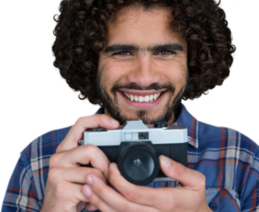 Close up portrait of smiling photographer holding camera 