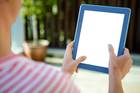 Female hands scrolling on tablet computer