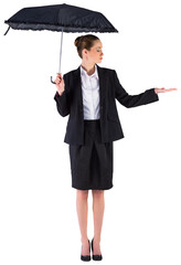 Businesswoman holding a black umbrella