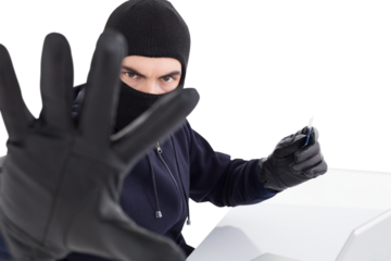 Angry hacker using credit card and gesturing