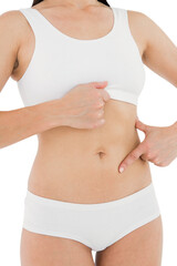 Fit woman touching her painful stomach 