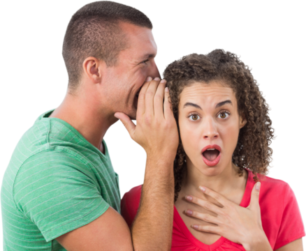 Businessman whispering secret into female colleague's ear