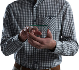 Fototapeta premium Mid-section of man using glass mobile phone