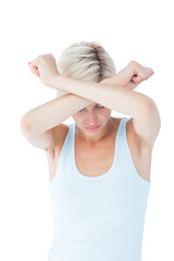 Upset woman holding her arms in front of her head