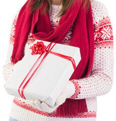 Festive brunette holding a gift