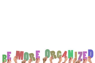 Cropped hands holding colorful words be more organised 