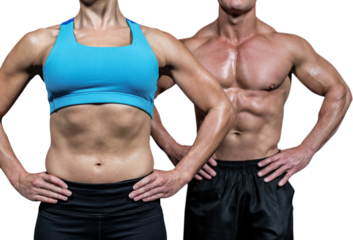 Midsection of muscular woman and man standing with hands on hip