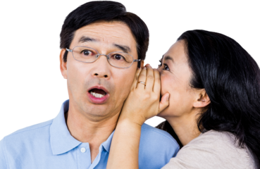 Woman whispering into partners ear