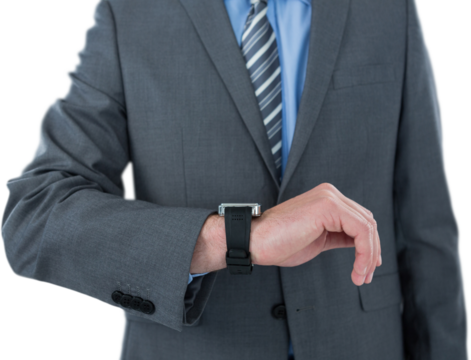 Businessman checking smart watch