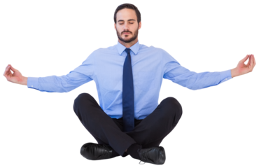Businessman in suit sitting in lotus pose