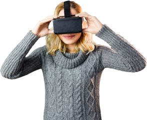 Smiling blond woman using virtual reality headset