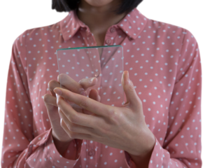 Mid section of female executive holding a glass smartphone