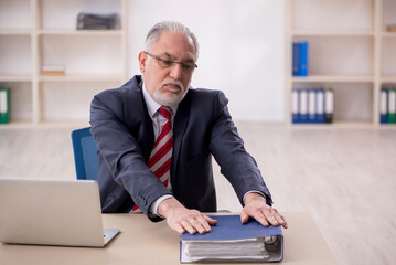 Old male employee and too much work at workplace