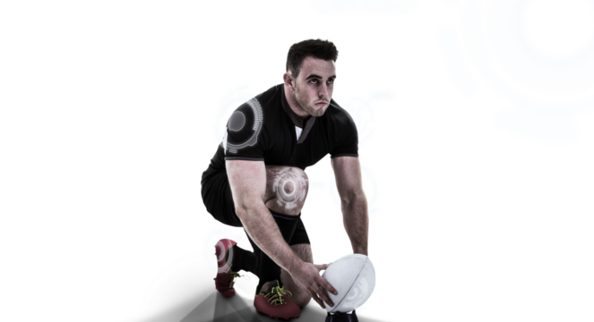 Rugby player positioning ball