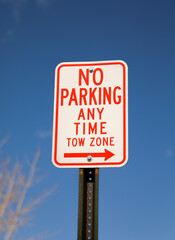 No parking signs symbolize restricted parking zones to ensure safety, access, or traffic flow. They communicate that vehicles must not stop, stand, or park in the designated area.