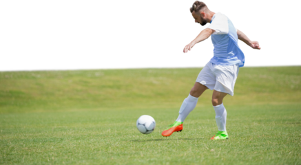 Male soccer player playing football
