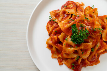 farfalle pasta in tomato sauce with parsley