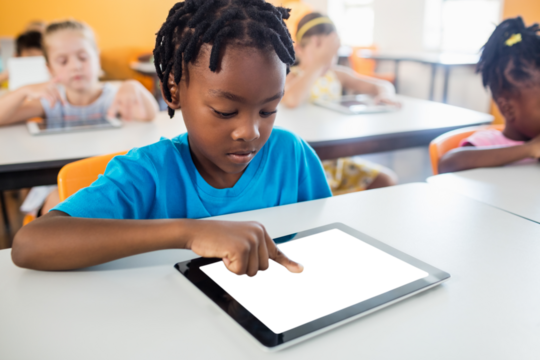 Boy using tablet computer
