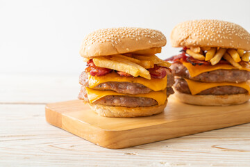 pork burger with cheese, bacon and french fries
