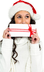 Woman covering mouth with gift box