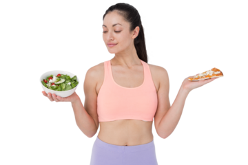 Smiling brunette looking at salad while holding pizza