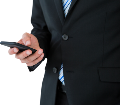 Midsection of businessman text messaging on mobile phone