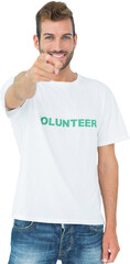 Portrait of a happy male volunteer pointing at you