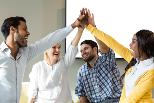 Cheerful colleagues high fiving