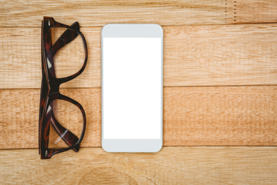 View of glasses and a smartphone