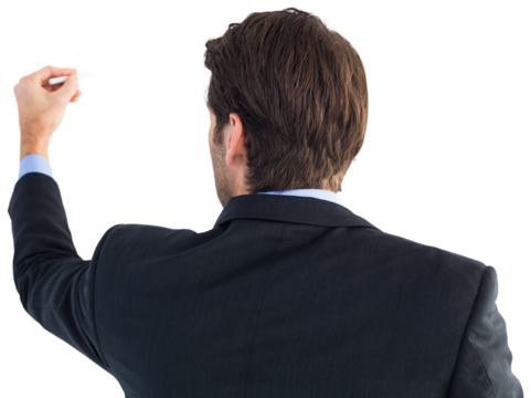 Rear view of businessman writing with a white chalk
