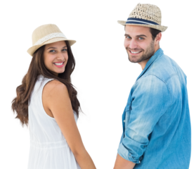 Happy hipster couple holding hands and smiling at camera