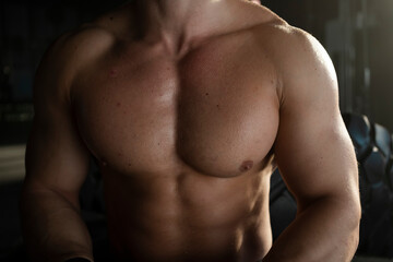 Strong healthy handsome athletic chest of muscular man, close up