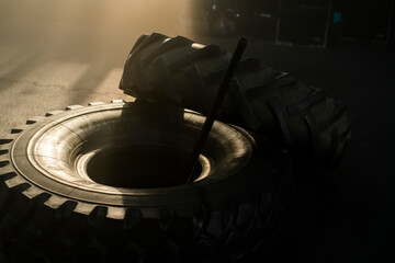 Heavy tire and hammer for bodybuilding training in sports gym