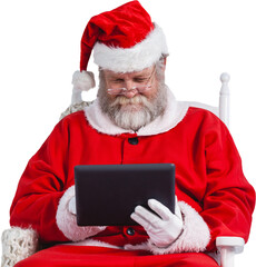 Santa Claus looking at digital tablet