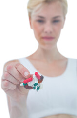 Woman throwing away batch of pills