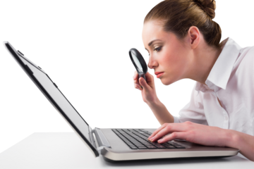 Attentive businesswoman typing on laptop