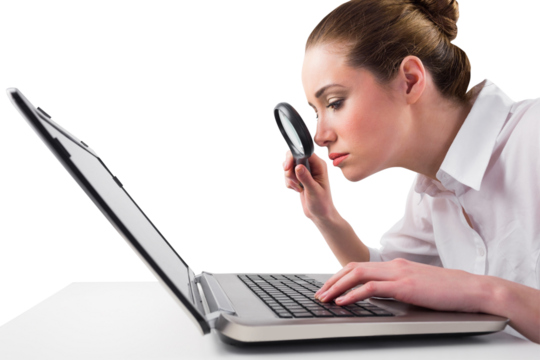 Attentive businesswoman typing on laptop - Powered by Adobe