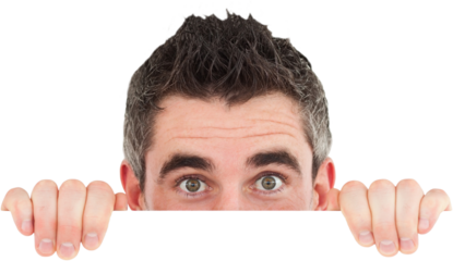 Man hiding behind white board