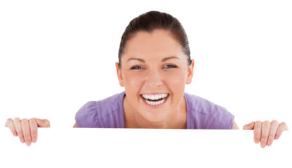 Portrait of a good looking woman posing behind a billboard while standing