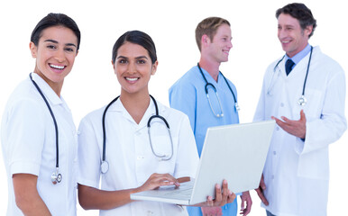 Fototapeta premium Happy doctors working with laptop