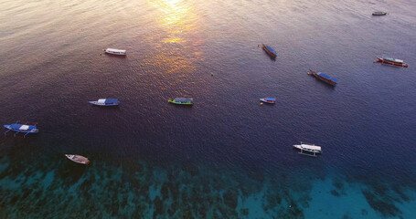 Passenger craft in sea during sunset