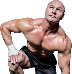 Bodybuilder exercising against black background