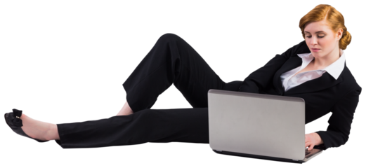 Redhead businesswoman using her laptop