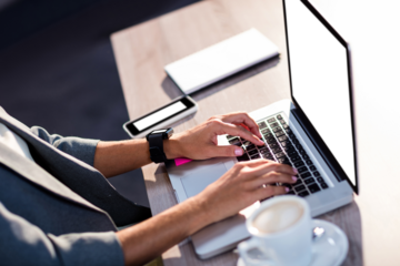 Midsection of man working on laptop