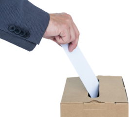 Businessman putting ballot in vote box